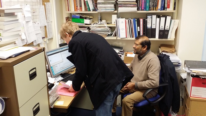 Cal, typing in his password at the local grid authority.
